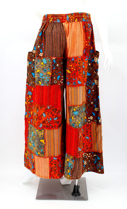 Back profile of hippie-style harem trousers with mushroom embroidery and wide-leg fit
