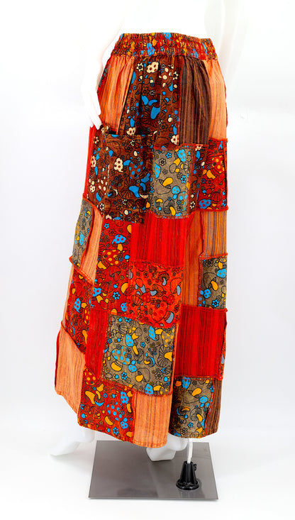 Back profile of hippie-style harem trousers with mushroom embroidery and wide-leg fit