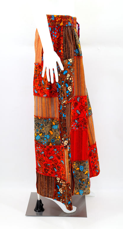 Side view of bohemian wide-leg harem pants featuring colorful mushroom patches and large pocket