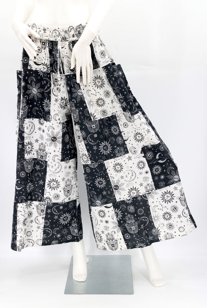 Front view of handmade celestial print wide-leg patchwork harem pants in natural cotton