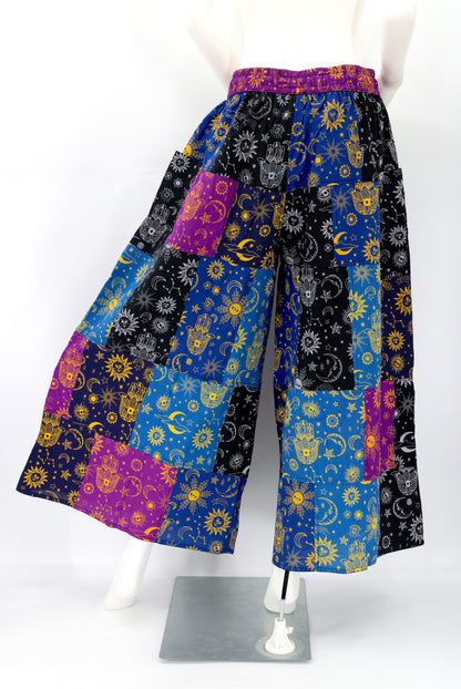 Back view showing unique patchwork pattern and relaxed fit of celestial print harem trousers