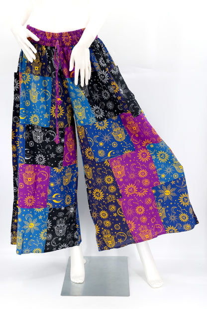 Front view of handmade celestial print wide-leg patchwork harem pants in natural cotton