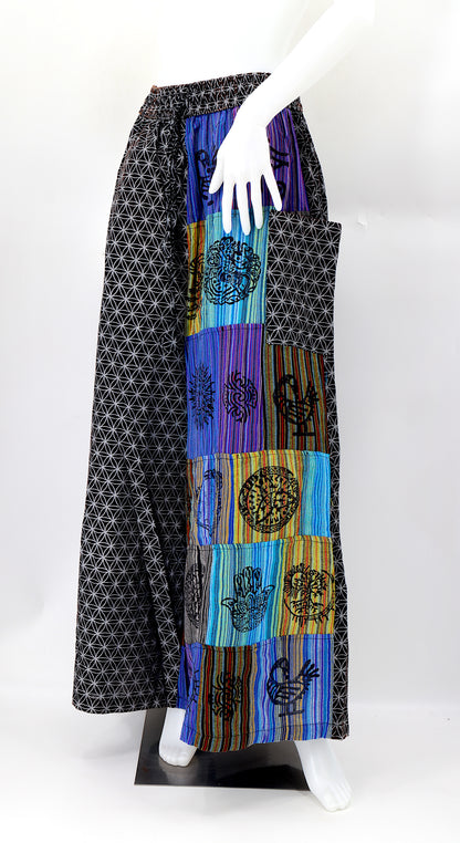 Front view of handmade Flower of Life patchwork wide-leg harem pants with pagan symbol block prints