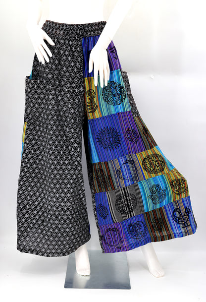 Front view of handmade Flower of Life patchwork wide-leg harem pants with pagan symbol block prints