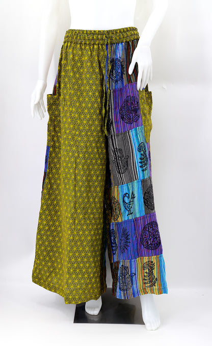 Front view of handmade Flower of Life patchwork wide-leg harem pants with pagan symbol block prints