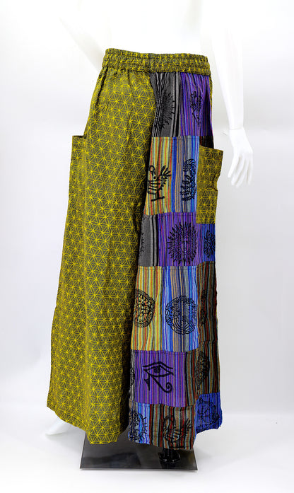 Back view of unique patchwork design featuring pagan symbols on wide-leg cotton harem trousers