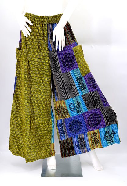 Front view of handmade Flower of Life patchwork wide-leg harem pants with pagan symbol block prints