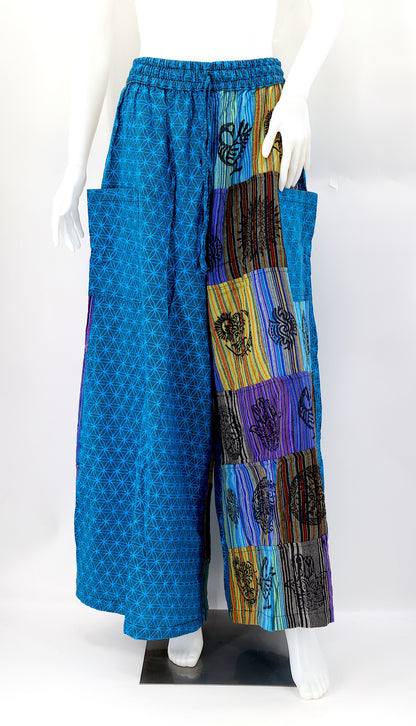 Front view of handmade Flower of Life patchwork wide-leg harem pants with pagan symbol block prints
