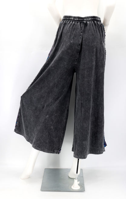 Back view of Himalayan handmade cotton trousers with natural embroidery pattern.