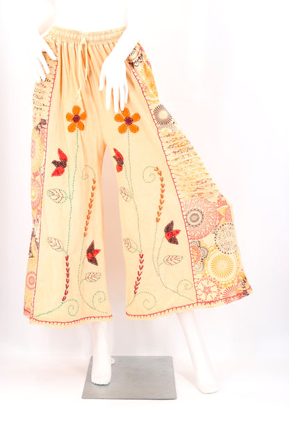 Mannequin wearing a Beige dress with floral and butterfly patterns on a white background