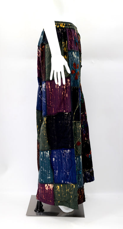 Side view showing adjustable elastic waistband and large pockets on handmade cotton pants